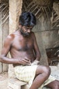 Unidentified indian worker artisan carving Hindu gods and saints from granite.