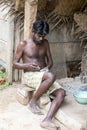 Unidentified indian worker artisan carving Hindu gods and saints from granite.