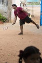 Documentary editorial image. Active indian preschool girl and boy playing badminton in outdoor court in summer. School sports for Royalty Free Stock Photo