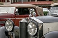 Detail of El espiritu del Ectasis, a small decorative sculpture on the hood of a Rolls Royce car, in a vintage car exhibition