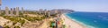 Poniente beach of Benidorm in summer seen from the heights of a skyscraper with the beach, the sea and other buildings of hotels Royalty Free Stock Photo