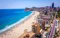 Poniente beach of Benidorm in summer seen from the heights of a skyscraper with the beach, the sea and other buildings of hotels Royalty Free Stock Photo