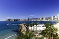 Poniente beach with palm trees, the port, skyscrapers and mountains , Benidorm Spain Royalty Free Stock Photo