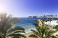 Poniente beach with palm trees, the port, skyscrapers and mountains , Benidorm Spain Royalty Free Stock Photo