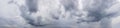 Ponoramic cloudy sky background. Gray clouds on sky