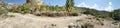 Ponoramic view of a curve rocky trail under a sunny day Royalty Free Stock Photo