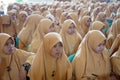 Faces of young Indonesian Muslim women at a religious event