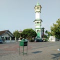 Ponorogo 11 September 2023 The mosque tower in Ponorogo square in the afternoon is white, green and yellow, the floor is paved