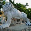 Ponorogo 11 September 2023The statue of a white lion& x27;s feet looks at the clear sky in the afternoon with green trees