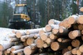 PONSSE Elk Forest Forwarder and Stack of Logs