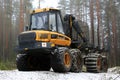 PONSSE Elk Forwarder in Foggy Winter Forest Royalty Free Stock Photo