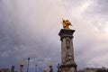 Pont Alexandre III Bridge with Golden Statues and Hotel de Invalides Dome in Paris, France Royalty Free Stock Photo