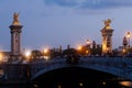 Pont Alexandre III Bridge and illuminated lamp posts at sunset. 7th Arrondissement, Paris Royalty Free Stock Photo