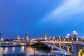 The Pont Alexandre III at night, is a deck arch bridge that spans the Seine in Paris. It connects the Champs-Ãâ°lysÃÂ©es quarter Royalty Free Stock Photo