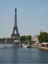 Pont de Bir-Hakeim and the Eiffel Tower with seagull showing boats at the pier beneath the bridge