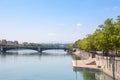 Pont de l`Universite bridge in Lyon, France over a panorama of the riverbank of the Rhone river Quais de Rhone