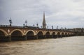 Pont de pierre Saint stone arch bridge over Garonne river in french city Bordeaux Gironde Nouvelle-Aquitaine France Royalty Free Stock Photo