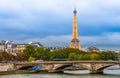 Pont des Invalides and the Eiffel Tower illuminated over the Seine in the evening in Paris, France Royalty Free Stock Photo