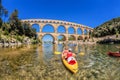 Pont du Gard with paddle boats is an old Roman aqueduct in Provence, France Royalty Free Stock Photo