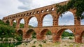 Pont du Gard - Panoramic view of ancient old Roman Aqueduct Pont du Gard ear Vers-Pon-du-Gard, Occitanie, France, Europe Royalty Free Stock Photo