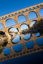 The Pont du Gard, vertical photography tilted over blue sky. Ancient Roman aqueduct bridge. Photography taken in Provence, Royalty Free Stock Photo