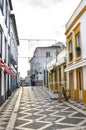 Ponta Delgada, Azores, Portugal - Jan 12, 2020: Empty street with bars and restaurants in the historical center of the Portuguese Royalty Free Stock Photo