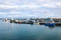 Ponta Delgada, Azores, Portugal - Jan 12, 2020: Industrial harbor in the capital city of Portuguese Azores Islands. Boats and Royalty Free Stock Photo