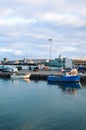 Ponta Delgada, Azores, Portugal - Jan 12, 2020: Industrial harbor in the capital city of Portuguese Azores Islands. Boats and Royalty Free Stock Photo