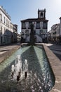 Closeup of the fountain and reflecting pool in front of Ponta Delgada City Hall and statue of Archangel Michael