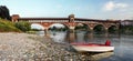 The Ponte Coperto of Pavia as seen from the shore of river Ticino
