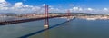 Ponte 25 de Abril Bridge in Lisbon, Portugal. Connects the cities of Lisbon and Almada crossing the Tagus River Royalty Free Stock Photo