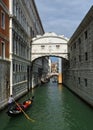 Ponte della Pagiia, and Bridge of Sighs over the rio del Palazza with boats and gongolas. Royalty Free Stock Photo