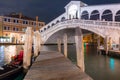 Ponte di Rialto bridge over the Grand Canal in Venice city at night, Italy Royalty Free Stock Photo