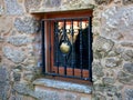 Window with iron grill and golden scallop shell, symbol of Camino de Santiago. Galicia, Spain. Royalty Free Stock Photo