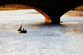 FLORENCE, ITALY, 10 AUGUST 2020: Touristic boat on Arno River at sunset, near Ponte Santa Trinita in Florence.