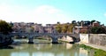 The St. Angelo bridge reflected in the Tiber river under a bleu sky, Rome, Vatican - Vaticano