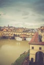 Ponte Vecchio bridge over Arno River with dark cloudy sky background in Florence,Tuscany, Italy Royalty Free Stock Photo
