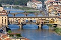 The Ponte Vecchio in Florence with tourists crossing it