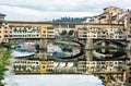 Ponte Vecchio is mirrored in the river Arno, Florence, Italy, cu Royalty Free Stock Photo