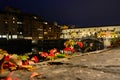 Ponte Vecchio under a clear sky by night Royalty Free Stock Photo