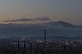 Pontedera and Monte Serra partially shrouded in fog at sunset, Tuscany, Italy Royalty Free Stock Photo