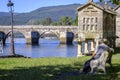 A man rests on a stone bench in Galicia (Spain)