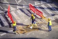 Some workers carried out repairs on a street