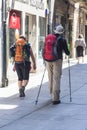 A couple of elderly pilgrims walk