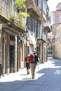 A couple of elderly pilgrims walk