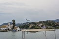 Pontikonisi area at Corfu island with flying airplane, Greece Royalty Free Stock Photo