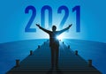Concept of a rebirth of the economy, with an optimistic man opening his arms to welcome the year 2021.