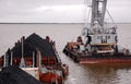 Ponton crane and barge with coal at Kolyma river Royalty Free Stock Photo