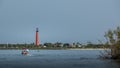 Pontoon travels towards Ponce de Leon Lighthouse. New Smyrna Beach, Florida Royalty Free Stock Photo