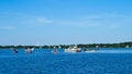 Pontoon boats at sandbar on lake in Minnesota.